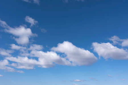 White and gray clouds in the blue skyの写真素材
