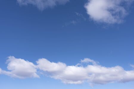 White and gray clouds in the blue skyの写真素材