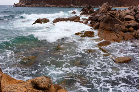 the waves of the Pacific Ocean on the rocksの写真素材