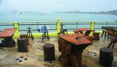 tables with drops of rain in a cafe on the beachの写真素材