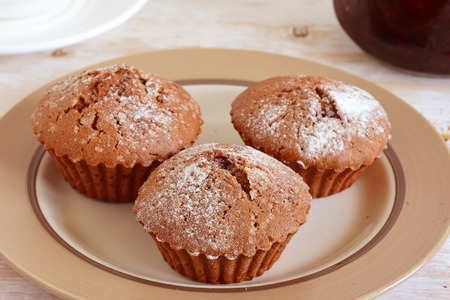 Homemade muffins on a white wooden backgroundの写真素材
