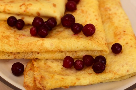 Pancakes with berry. Traditional Russian pancakes.
