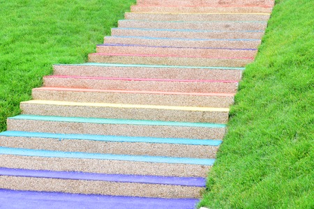 Stairs leading up. Leadership concept stairs to success. Green grass and stairs for interior backgroundの写真素材