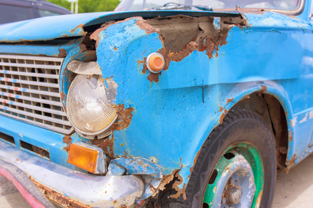 Old rusty car. Front headlight of old carの写真素材