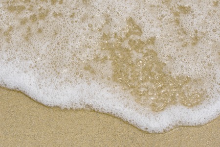 Sea foam on the beach. Sea beach and soft waveの写真素材