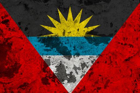 Antigua and Barbuda flag on old wall. Patriotic grunge background. National flag of Antigua and Barbudaの写真素材