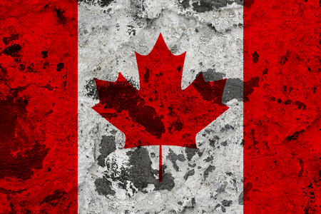 Canada flag on old wall. Patriotic grunge background. National flag of Canadaの写真素材
