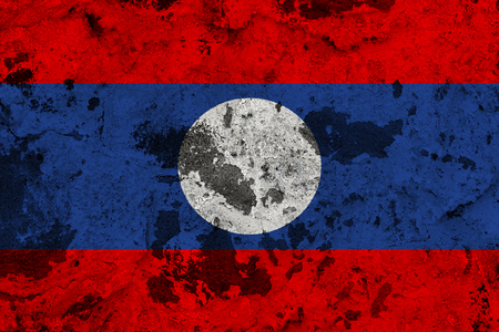 Laos flag on old wall. Patriotic grunge background. National flag of Laosの写真素材