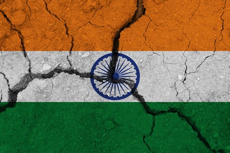 India flag on the cracked earth. National flag of India. Earthquake or drought conceptの写真素材