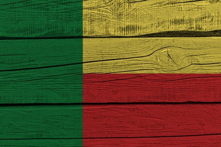 Benin flag painted on old wood plank. Patriotic background. National flag of Beninの写真素材