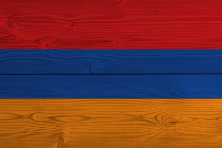 Armenia flag painted on old wood plank. Patriotic background. National flag of Armeniaの写真素材