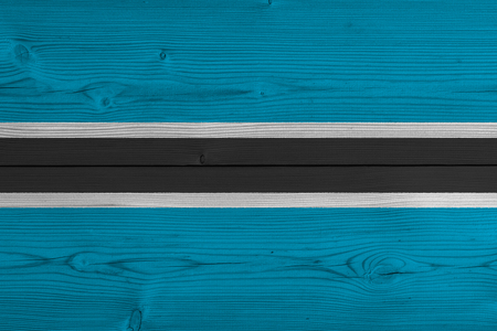 Botswana flag painted on old wood plank. Patriotic background. National flag of Botswanaの写真素材