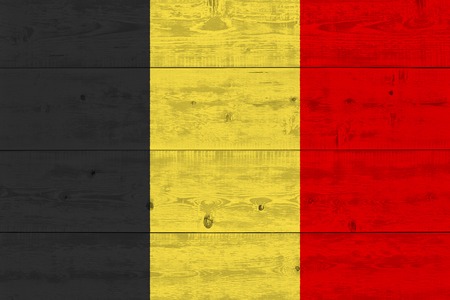 Belgium flag painted on old wood plank. Patriotic background. National flag of Belgiumの写真素材