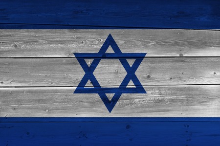 Israel flag painted on old wood plank. Patriotic background. National flag of Israel