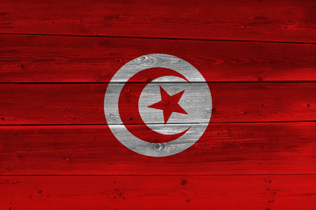 Tunisia flag painted on old wood plank. Patriotic background. National flag of Tunisiaの写真素材