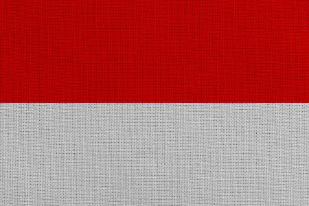 Monaco fabric flag. Patriotic background. National flag of Monacoの写真素材