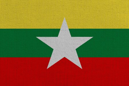 Myanmar fabric flag. Patriotic background. National flag of Myanmarの写真素材