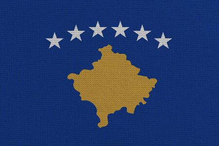 Kosovo fabric flag. Patriotic background. National flag of Kosovoの写真素材