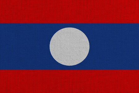 Laos fabric flag. Patriotic background. National flag of Laosの写真素材