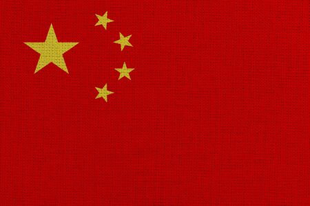 China fabric flag. Patriotic background. National flag of Chinaの写真素材