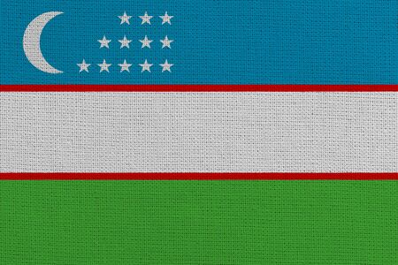 Uzbekistan fabric flag. Patriotic background. National flag of Uzbekistanの写真素材