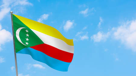Comoros flag on pole. Blue sky. National flag of Comorosの写真素材