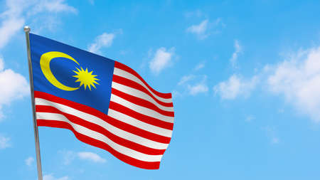 Malaysia flag on pole. Blue sky. National flag of Malaysia