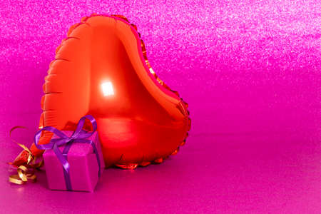little gift with a heart on a pink background. high qualityの写真素材