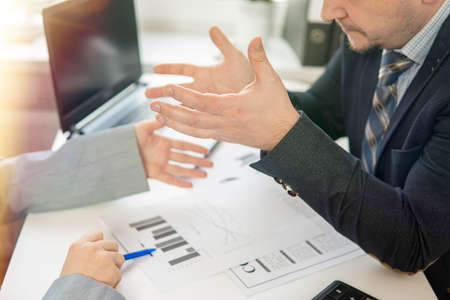 partial focus. hands of two businessmen who argueの写真素材