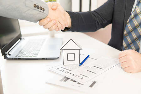 two businessmen chew their hands after signing a contract. Business concept.の写真素材