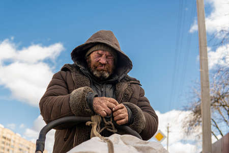 Minsk, Belarus - March 06, 2021: Portrait of white homeless man outside