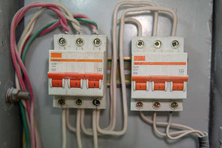 Voltage switchboard with circuit breakers. Electrical backgroundの写真素材