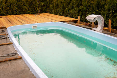 unfinished pool with wooden floor. installation of a new pool. repair work on the swimming pool.