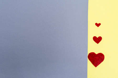three hearts. background grey yellow.concept Valentines Day postcard