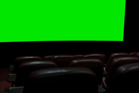part of a movie screen and rows of brown leather chairs in an empty cinema hall in a movie theater during quarantine coronavirus.の写真素材