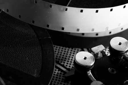 Film reel inside old-fashioned retro movie camera mechanismの写真素材