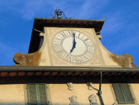 Campi Bisenzio, Tuscany, Italy, September 8, 2019. Historical center of the town, Palazzo Spartaco Conti at sunset, building facade details, old clock.のeditorial素材