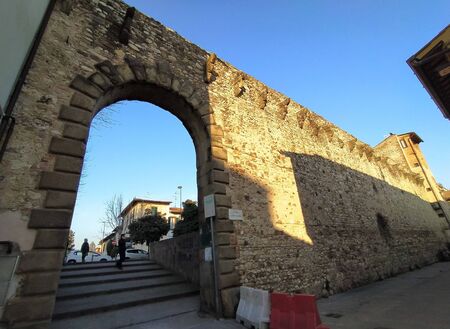 Campi Bisenzio, Tuscany, Italy, February 22, 2020. Medieval door of St. Stephen (italiano-Porta Santo Stefano) to the north, arched entrance. The north section of the old town walls.のeditorial素材
