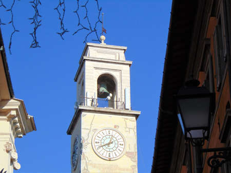 Pisa Tuscany Italy. January 7th, 2019. View of the clocktower of the Palazzo Pretorio from Banchi street, adjacent to the Ponte di Mezzo bridge.のeditorial素材