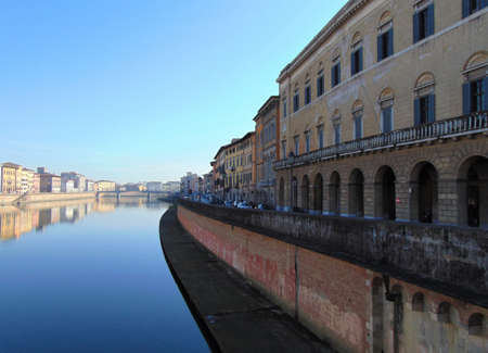 Pisa Tuscany Italy. January 7th, 2019. View of the city from bridge "Ponte di Mezzo" on river Arno at sunset, panorama.のeditorial素材