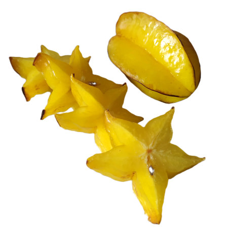 Carambola fruit, isolated, close-up. Fresh ripe yellow fruits of Averrhoa carambola, one fruit is whole and the other is sliced. Sliced star fruit on a white background.の写真素材