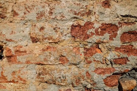 Fragment of an old red brick wall. Texture, background. Horizontal orientation.の写真素材