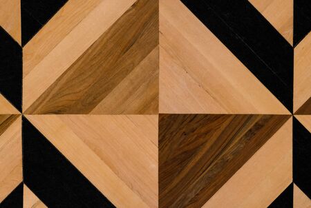 Fragment of ancient parquet of natural oak wood with geometric pattern. Horizontal orientation. View...