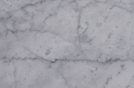 Fragment of the old floor of natural marble in dark gray and light gray colors. Horizontal orientation. Selective focus.の写真素材