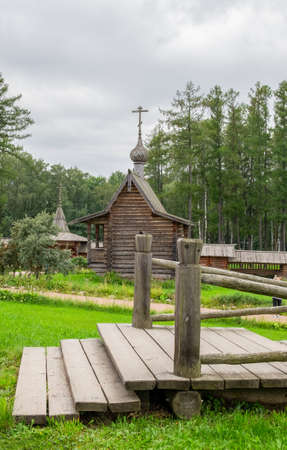 Manor Bogoslovka, Leningrad region, Russia - August 15, 2020. Ancient wooden buildings of churchyard. Architecture of the north of old Russia. Historical reconstruction, local tourism. Selective focusのeditorial素材