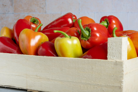 Wooden box with ripe sweet peppers. harvest. selective focus.の写真素材