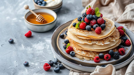 A stack of pancakes with fresh berries, honey and sour cream on a plate. Maslenitsa. AI generated.の素材