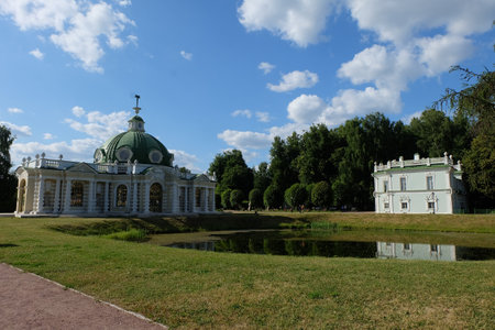 Moscow, Russia - 06.21.2023: Kuskovo estate, ensemble of the Italian Pond: Grotto pavilion and Italian house on the bank of a small pondのeditorial素材