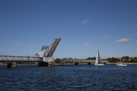 Aalborg, Denmark - September 21, 2014: Drawbridge at Aalborg Limfjord is opened to let a sailing boat pass through.のeditorial素材