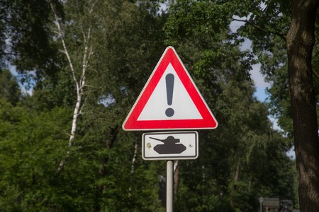 Photograph of a road sign warning for crossing tanks.の写真素材